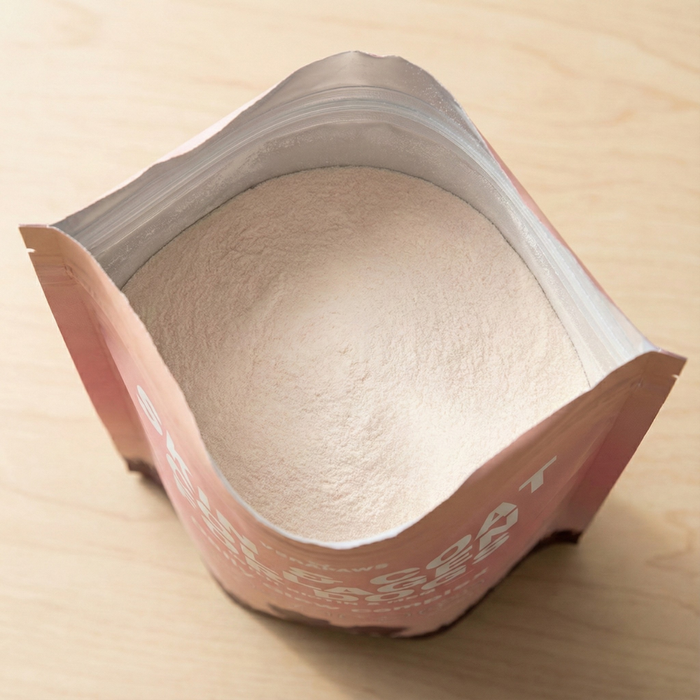 Open bag of VeraPaws Skin and Coat Collagen For Dogs showing powder content.