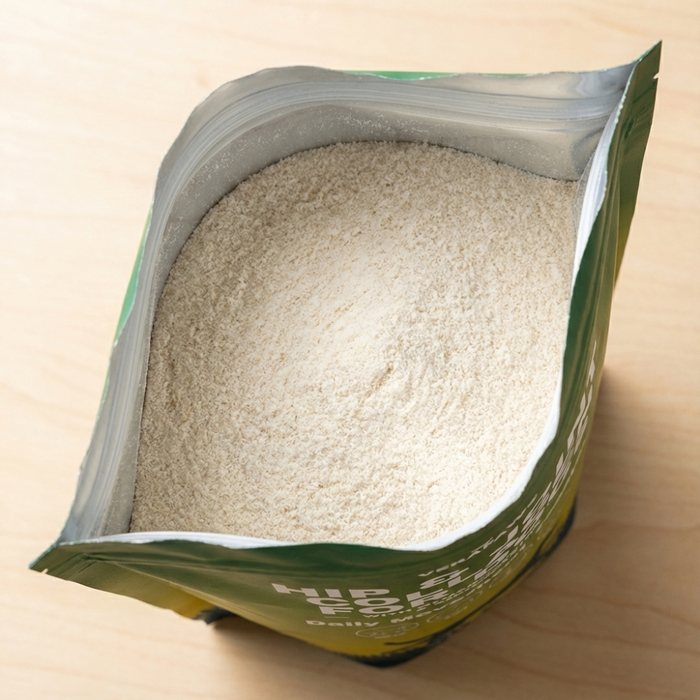 An open bag of VeraPaws Hip and Joint Collagen For Dogs showing collagen powder.